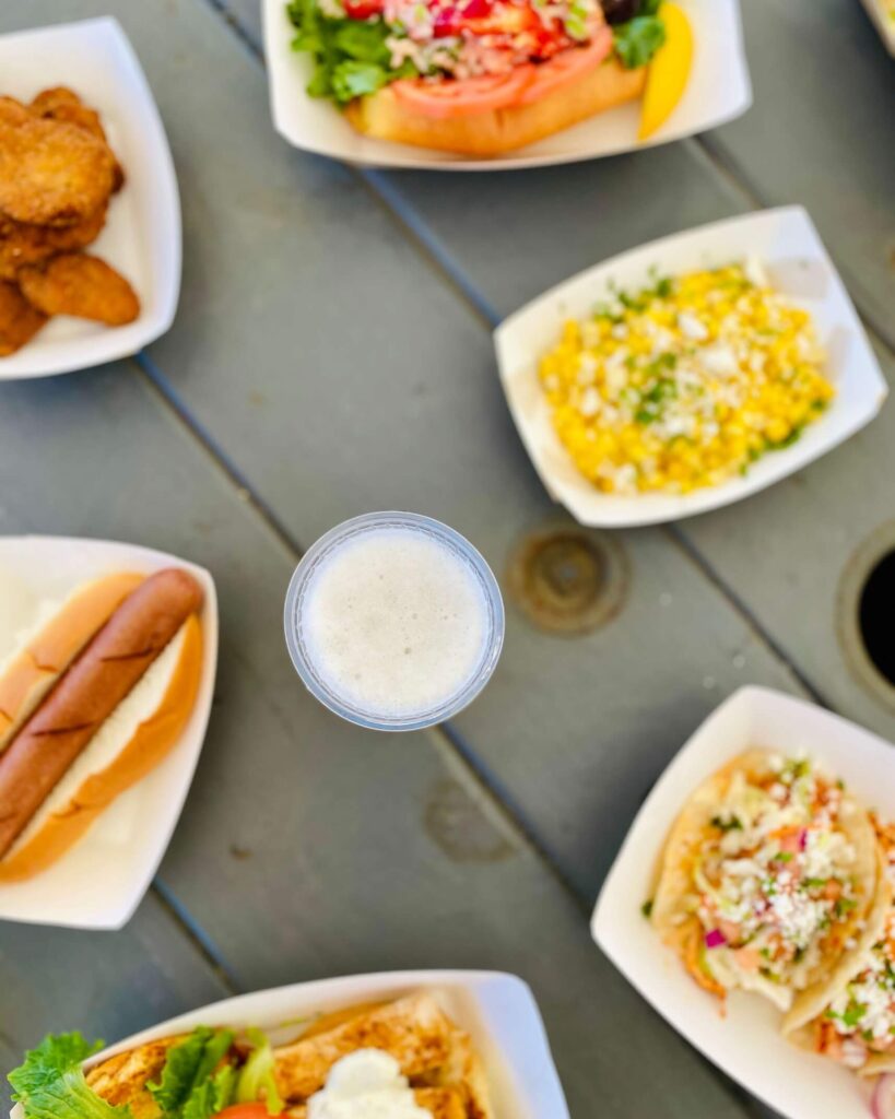 Overhead picture of appetizers and beer